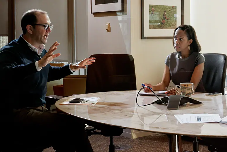 A person enjoying a beautiful travel destination, representing a savings goal achieved